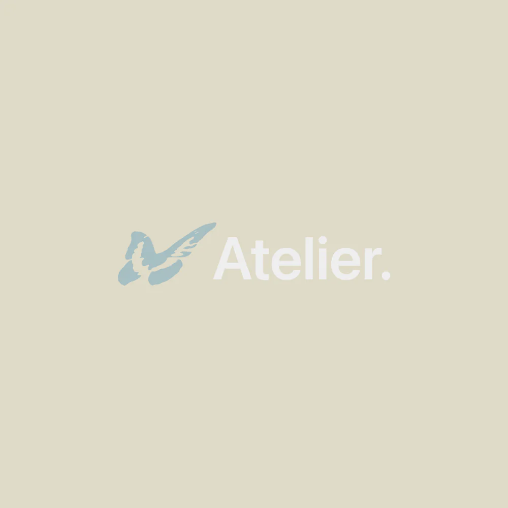 Atelier logo in pale blue and white on a warm neutral background