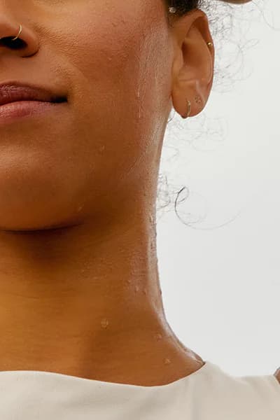 Close portrait crop of a woman wearing a white shirt